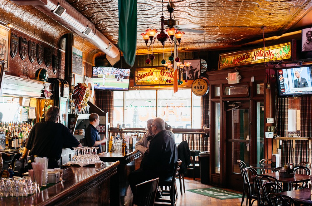 Owner Pat Osman looks out the window of Nemo’s, a classic baseball bar in Corktown.
